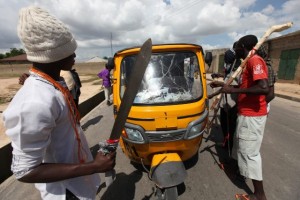 Civilian JTF man checkpoints in Maiduguri~(AP Photo)